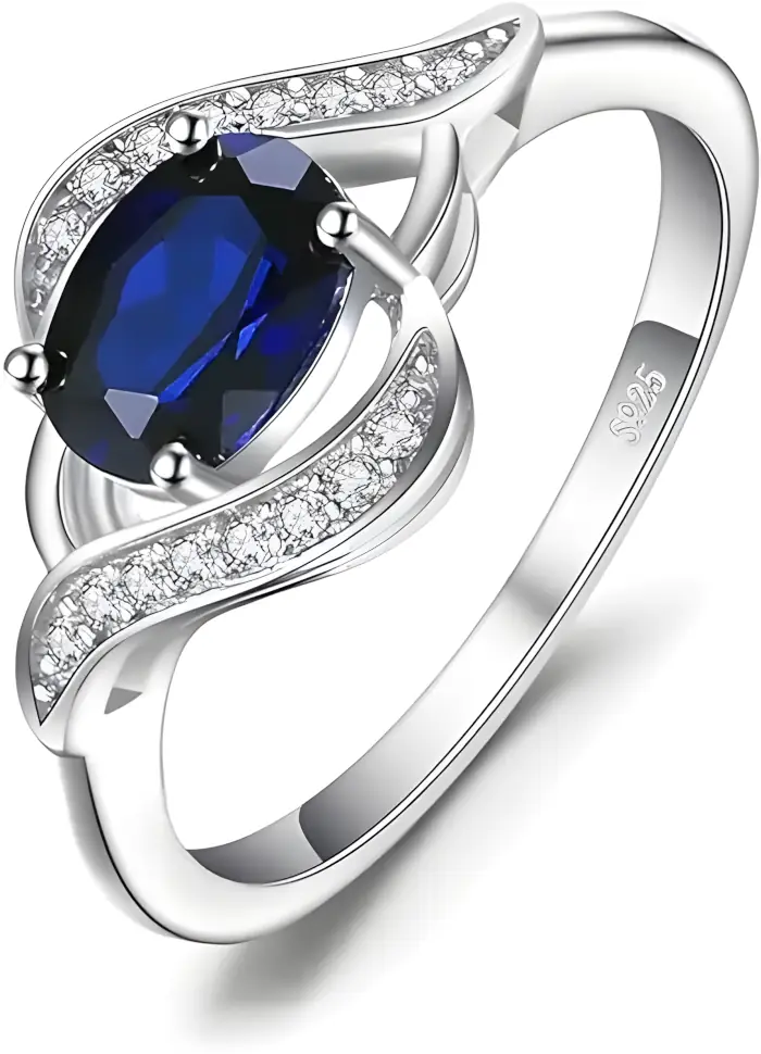 Stříbrný prsten se safírem a čirými zirkony